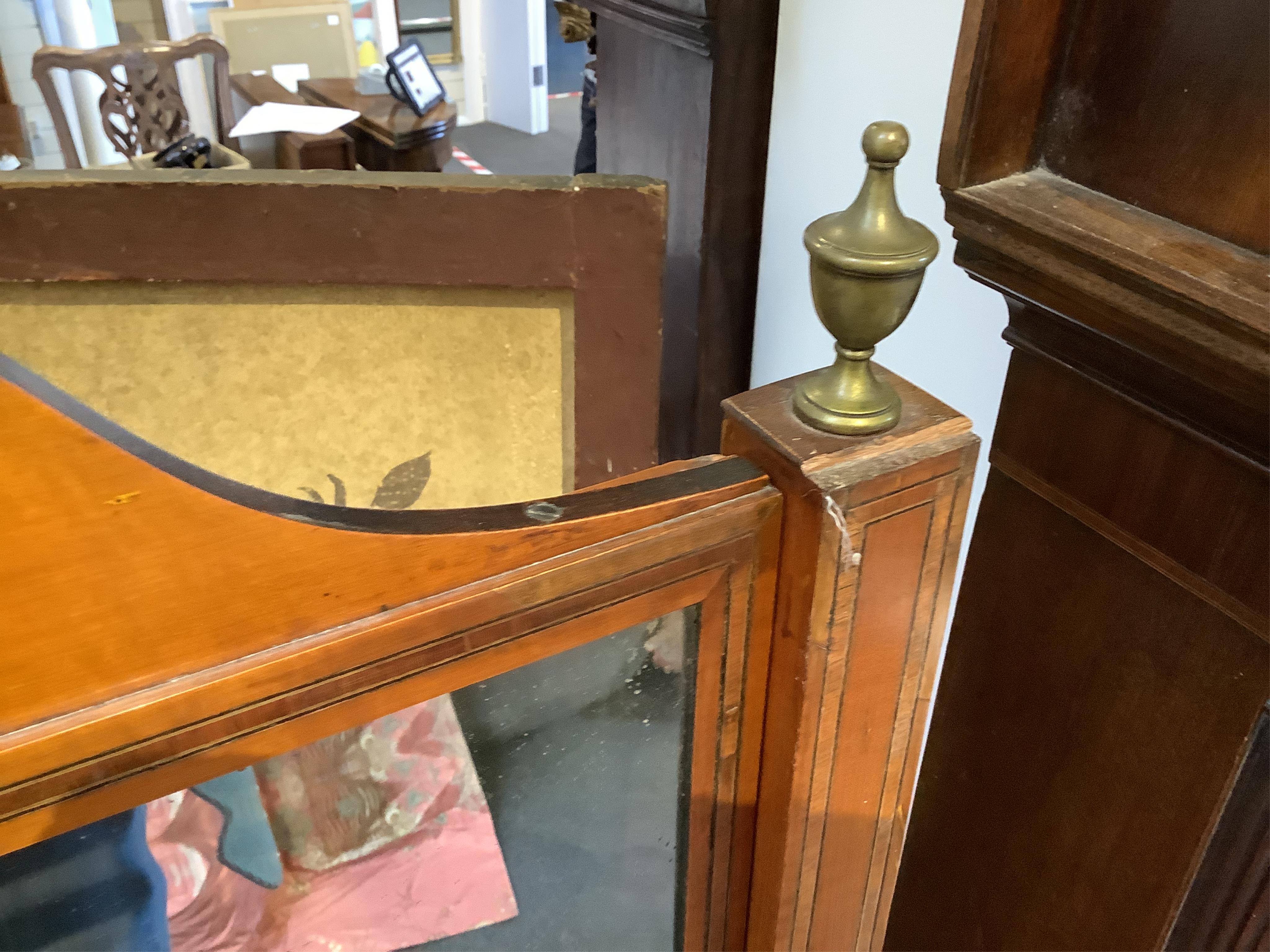 An Edwardian satinwood cheval mirror